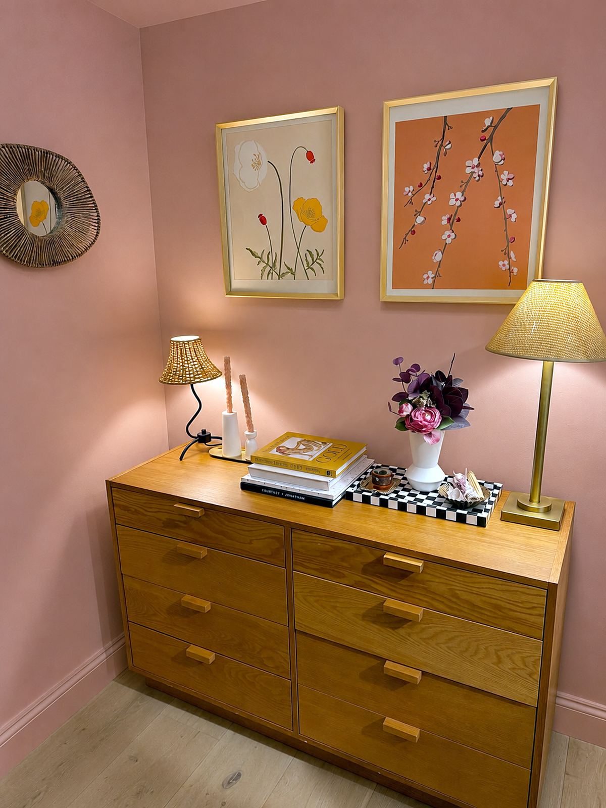 A vintage dresser from Courtney's husband's childhood bedroom, restyled with new decor and lighting